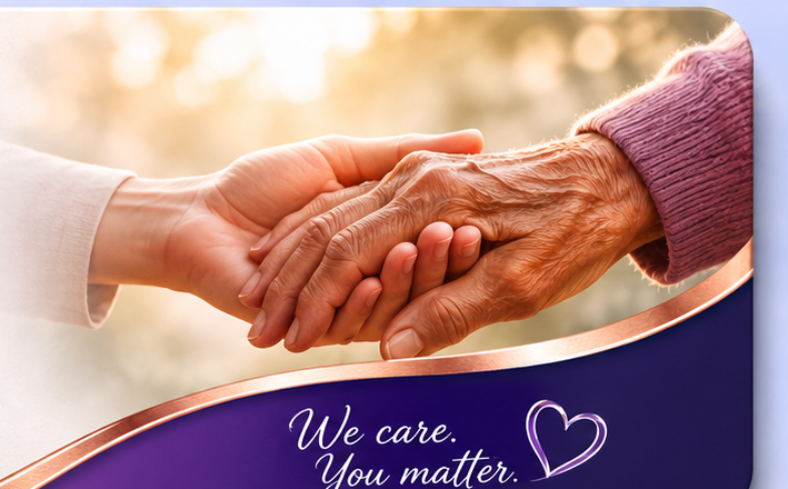 A caregiver gently holding the hands of an older adult